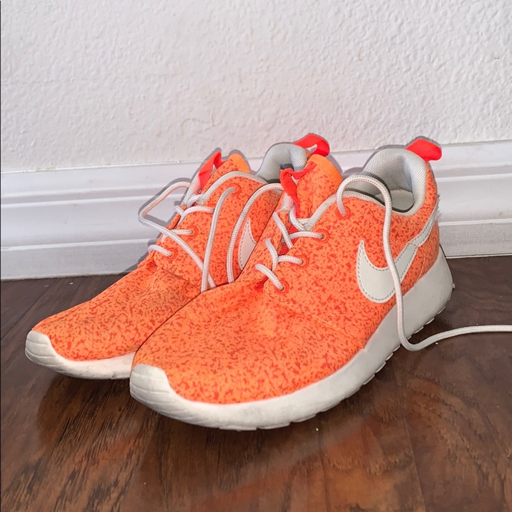 Orange Nike shoes